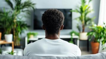 Man Watching Television In A Home Setting photo