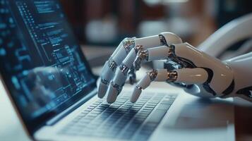 Robotic hand typing code on a laptop computer photo