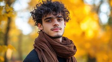 Young Man with Curly Hair Autumn Background photo