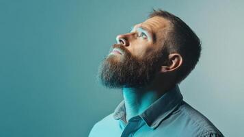 Bearded Man Gazing Upward Contemplatively photo