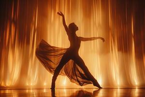 A silhouette of a woman in a dress dancing photo