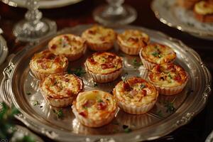 A silver tray with mini quiches on it photo