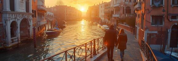 A canal in venice with a bridge and boats photo