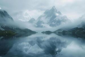 A mountain range is reflected in a lake photo