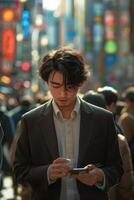A man in a suit is looking at his phone photo