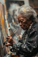 An older woman painting in an art studio photo