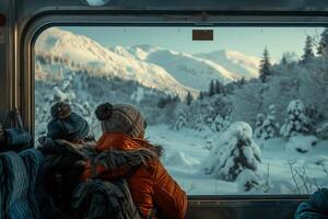 Two people looking out the window of a train photo