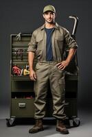 A man in a work uniform standing next to a toolbox photo