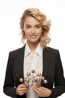 A woman in a suit holding a model of a molecule photo