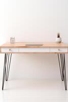 A desk with a laptop and a clock on it photo