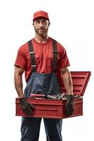 A man in a red hat and overalls holding a toolbox photo