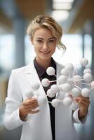A woman in a lab coat holding a model of molecules photo