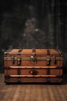 An old trunk sitting on a wooden floor photo