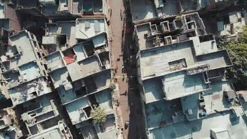 Directly Overhead Aerial View of Dense Urban Street Scene with Flat Rooftops and Daily Life video