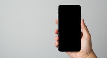 A blank smartphone screen displayed in a hand, with a clean background for app design. photo