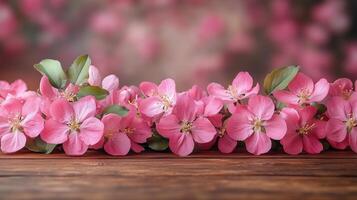 A pink apple blossoms on a wooden table with a blurred garden background. 9 photo