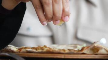 Enjoying flavorful toppings on a fresh pizza at a local eatery video