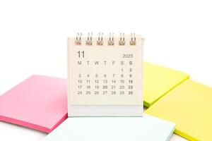 Mini Desk Calendar for NOVEMBER 2025 background. Calendar concept with 2025 NOV calendar. Sticky note. isolated on white background. photo