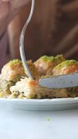 Discover delicious baklava made with nuts and honey in local cafe video