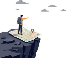 Adventurer standing atop a cliff pointing towards the horizon while examining a large map in a flat illustration vector