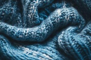 Closeup of Soft Blue Knitted Wool Fabric with Textured Pattern in Gentle Folds for Winter Backgrounds photo
