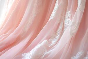 Soft Pink Lace Fabric with Delicate White Floral Embroidery Closeup in Natural Light Draping Texture photo