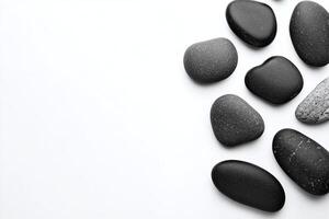 Black Smooth Spa Stones Arranged on White Minimalist Background for Relaxation and Balance Concept photo
