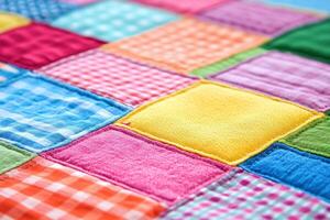 Patchwork Quilt Closeup with Colorful Fabric Squares in Bright Patterns on Smooth Background photo