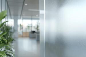 Frosted Glass Partition with Green Plants in Modern Office Interior with Natural Light and Blurred Background photo