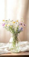 Rustic Bouquet of Wildflowers in Transparent Glass Jar on Light Wooden Table with Soft Beige Background photo