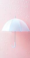 White Umbrella with Water Droplets on Pastel Pink Background for Rain and Weather Concepts photo