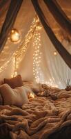 Cozy Indoor Bed Setup with Warm String Lights and Neutral Textured Blankets in Tent-Like Space photo