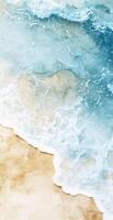 Aerial View of Turquoise Ocean Waves Crashing on Sandy Beach with Foam and Golden Shoreline photo