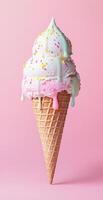 Vanilla and Strawberry Ice Cream Cone with Sprinkles on Pink Background Perfect for Summer Themes photo