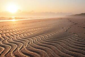 Sunset on the beach with waves and sand photo