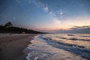 A beach at night with stars and the milky way photo