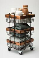 A three tiered basket with a stack of dishes and cups photo