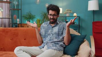 Indian man guy asking why, what reason of failure demonstrating disbelief irritation by troubles video