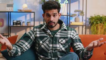Indian man guy asking why, what reason of failure demonstrating disbelief irritation by troubles video