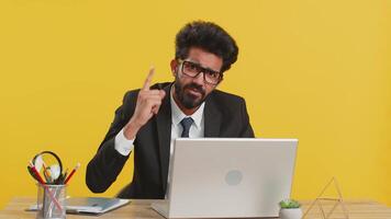 Displeased angry mad indian businessman having quarrel gesturing hands with irritation bad fail work video