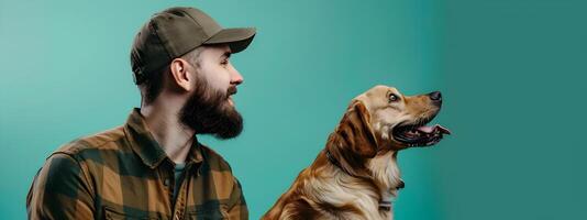 Joyful Service Dog Trainer Engrossed in Teaching Purebred Canine on Colorful Backdrop photo