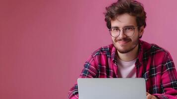 Young Technical Writer Exuding Joy while Creating Content on a Colorful Background photo