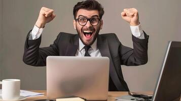 Business Analyst Celebrating Successful Project Completion at Office Workstation photo
