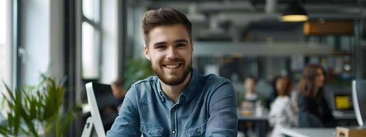 Confident Young Manager Smiling at Desk in Modern Office photo