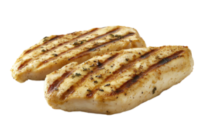 Grilled chicken fillets served on a clean white plate. png