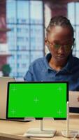 African American female freelancer browse troubleshooting guide next to copy space, working on debugging router issues to restore home network. Young woman struggles to solve tasks. Camera A. video