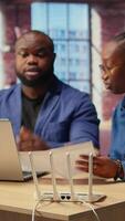 Discouraged African American couple struggles with an unstable Wi Fi network, getting angry while they are troubleshooting to fix the error. Stressed people with lots of remote tasks. Camera A. video