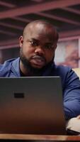 African american couple work on a management project for freelancing, using a laptop to research business trends and manage an online brand. Successful remote career development. Camera B. video
