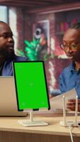 Black man and woman getting angry at home internet next to mockup screen, identifying weak connection and testing different troubleshooting techniques to fix their network errors. Camera A. video