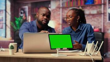 Irritated people trying to fix an ongoing Wi Fi problem by rebooting modem next to copy space, troubleshooting connection errors and testing different network configurations. Camera B. video